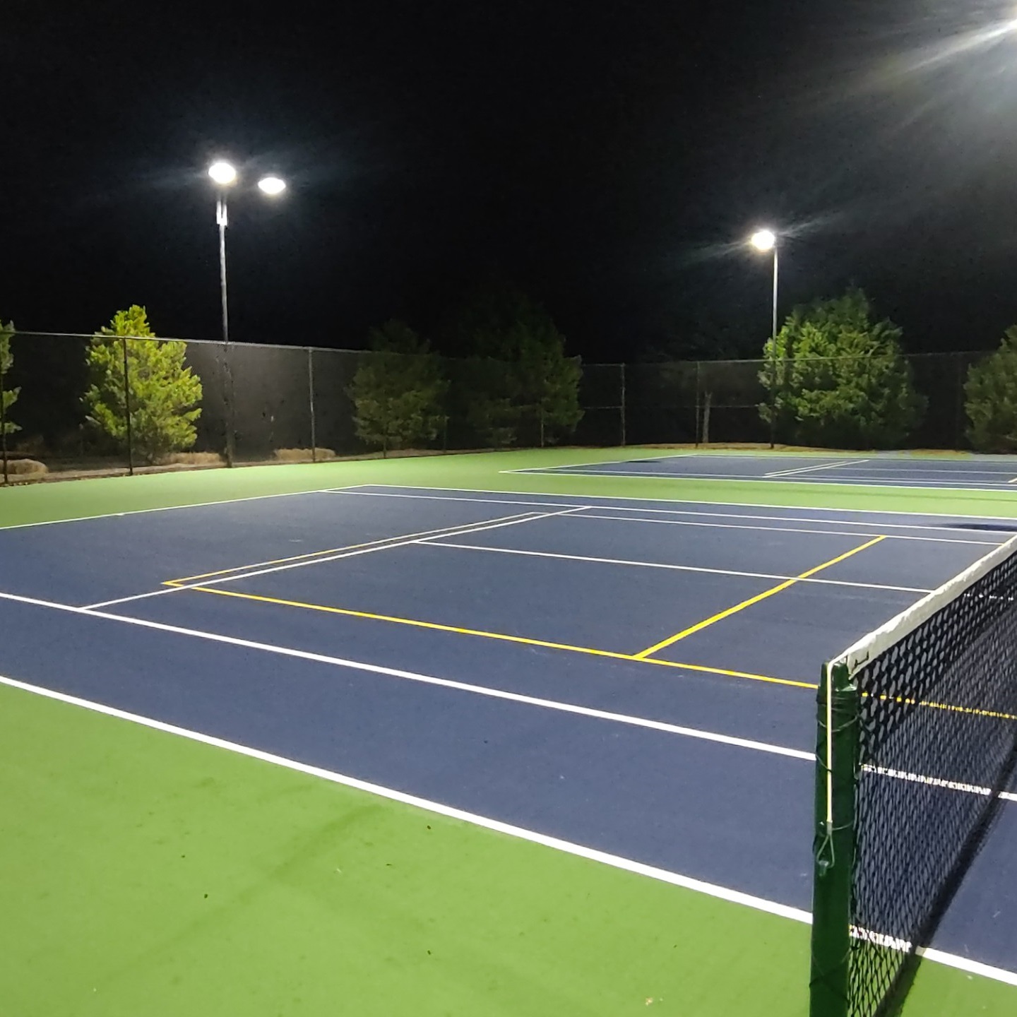 Retrofitted tennis courts using our LED lighting